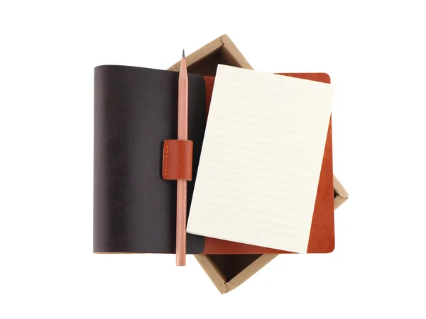 Lápis isolado com notebook sobre fundo branco — Fotografia de Stock