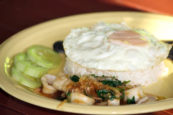 Thailand fast food rice and Fried egg with spicy Squid — Stock Photo, Image