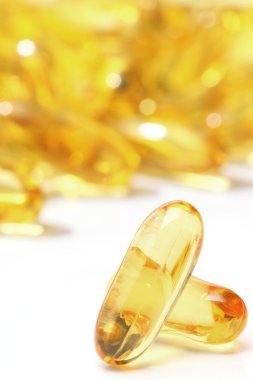 Gold pills isolated clipart