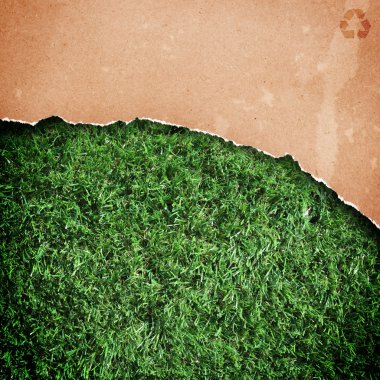 Recycled paper over grass clipart