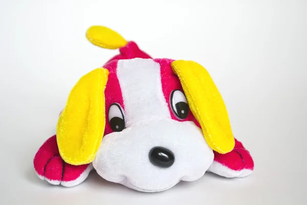 Pink lying toy dog — Stock Photo, Image