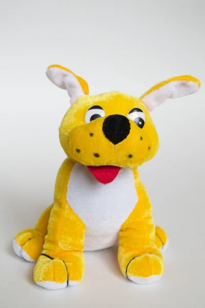 Pies zabawka żółty — Zdjęcie stockowe