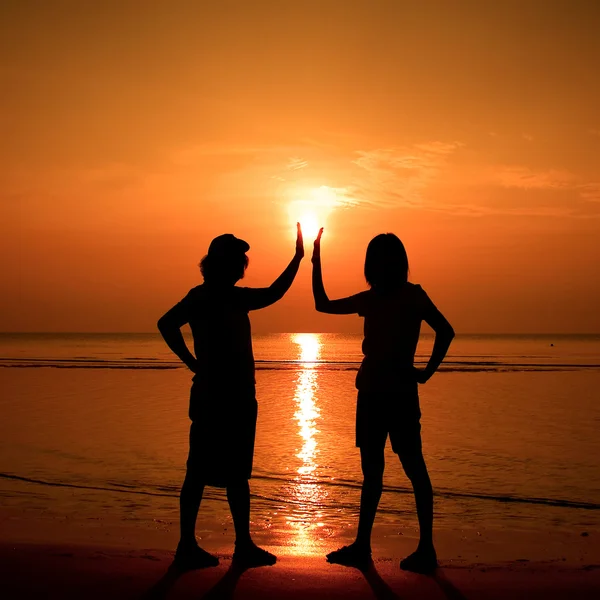Funny silhouette on the beach — Stock Photo, Image
