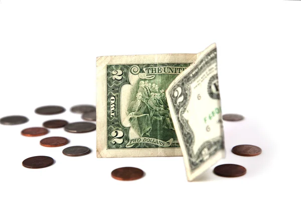 Два долари і монети — стокове фото