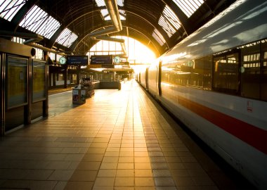 Morning sun at the train station clipart