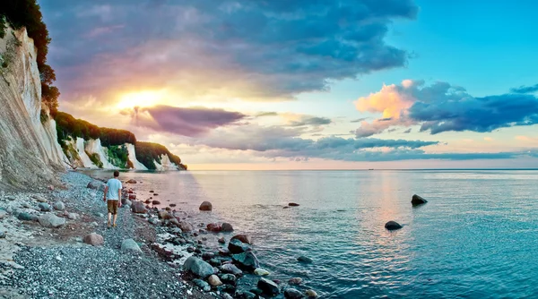 stock image Man walking along the coast