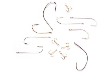 Shinny and new fishing hooks on white clipart