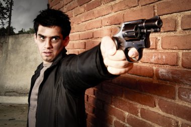 Man with gun in an alley clipart