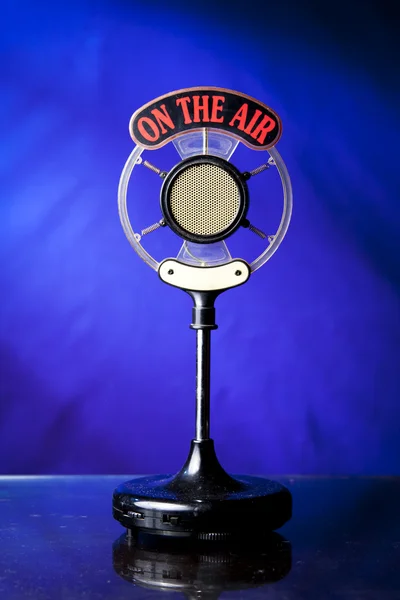 Photo of radio microphone on blue background — Stock Photo, Image
