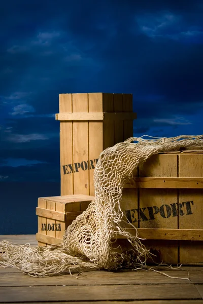 Wooden crates packed for export on dock — Stock Photo, Image