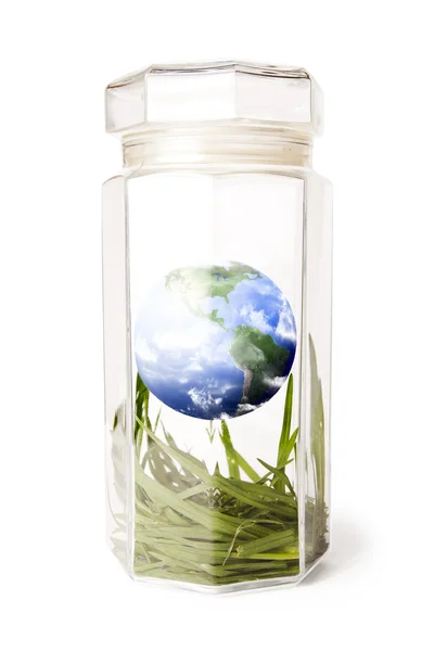 保护地球里面被隔绝在白色水晶 jar — 图库照片
