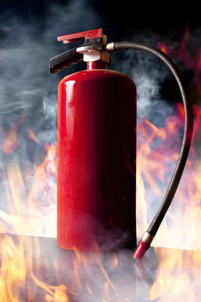 Fire extinguisher and flames — Stock Photo, Image