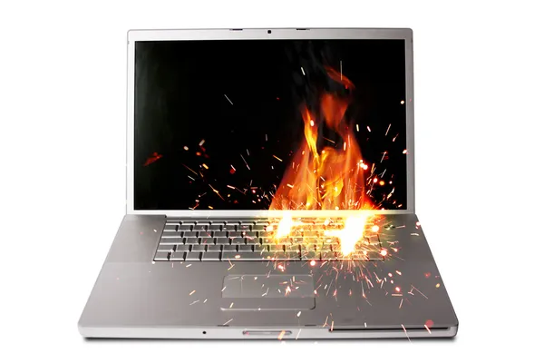 Laptop computer on fire, represents computer damage, loss of data — Stock Photo, Image