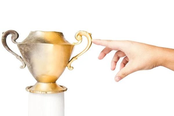 stock image Fingertip turns a vintage vase into gold
