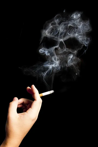Hand holding a cigarette with deadly smoke. — Stock Photo, Image