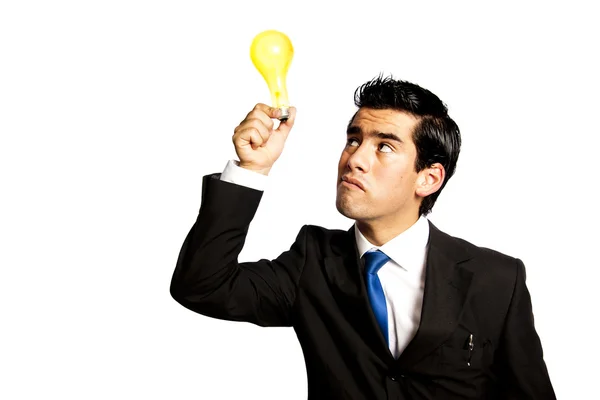 明るい電球のアイデアを持つ若いビジネス男 — ストック写真