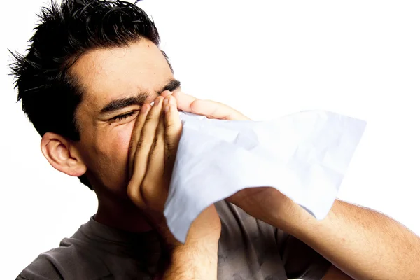 stock image A young man having a cold or allergy.