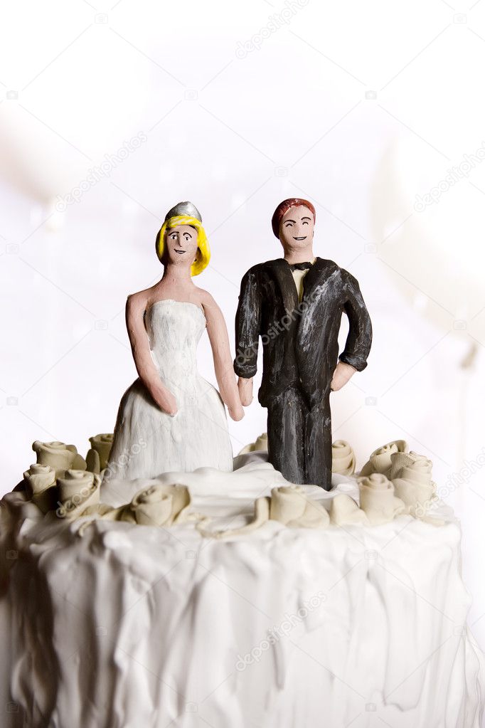 Figurines of bride and groom on a wedding cake