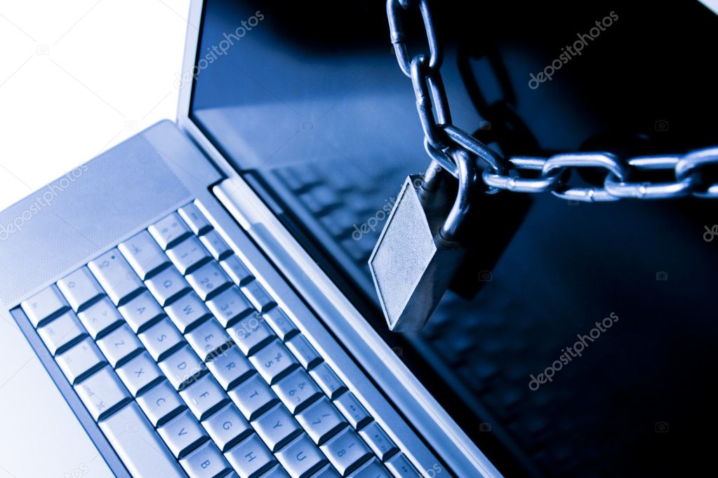 Closeup shot of laptop keyboard secured with chain and padlock