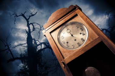 Dark antique clock at night clipart