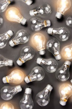 Many light bulbs off and others with light clipart