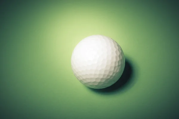 Golf ball on green background — Stock Photo, Image