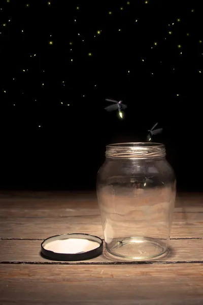 stock image Fireflies in a jar