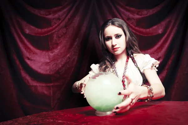 Dark vintage photo of a gypsy with her crystal ball — Stock Photo, Image