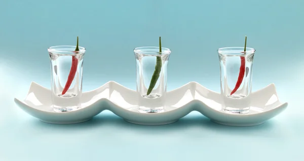 Chilifrukter i snapsglas — Stockfoto