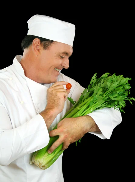 Шеф-повар, кормящий сельдерей — стоковое фото