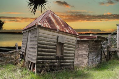 Dilapidated Huts By The Water clipart