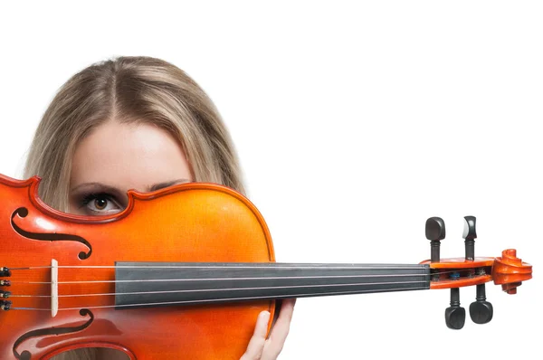Young woman holding a violin and looking through it — Stock Photo, Image