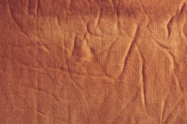 The texture of crumpled brown coarse cloth — Stock Photo, Image