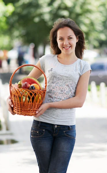 The young caucasian girl with basket — Stock Photo, Image