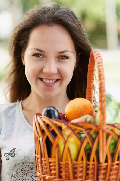 The portrait of young caucasian girl with products — Stock Photo, Image