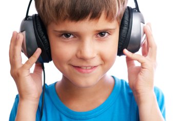 The young boy is holding the headphones clipart