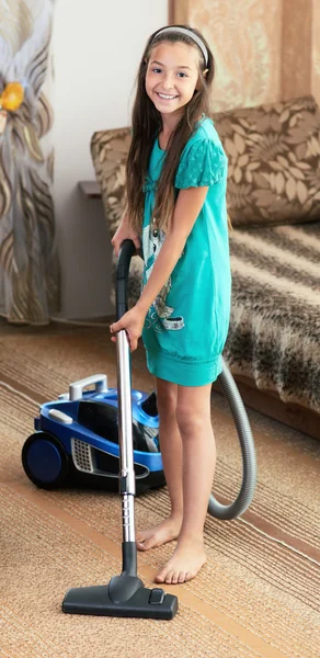The girl is vacuuming — Stock Photo, Image