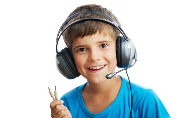 The young boy is listening to music — Stock Photo, Image