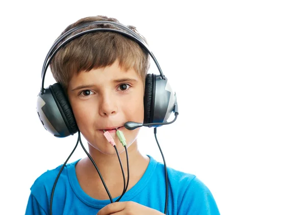 The young boy is listening to music — Stock Photo, Image