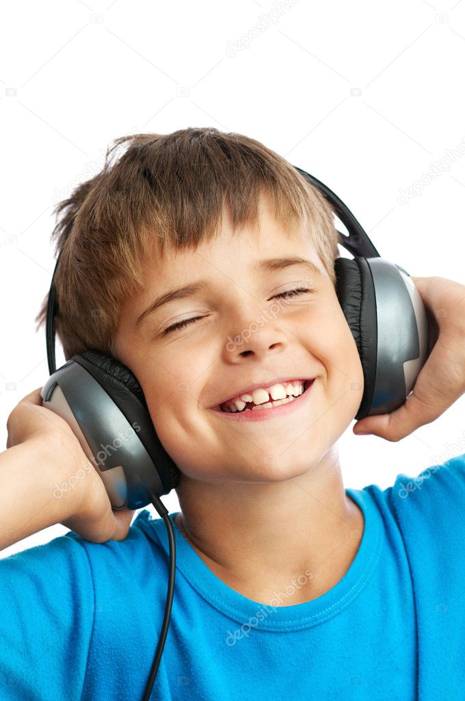 The boy is listening to music