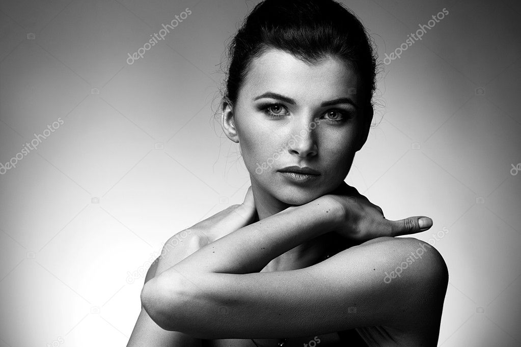 Portrait of woman in exclusive jewelry on natural background