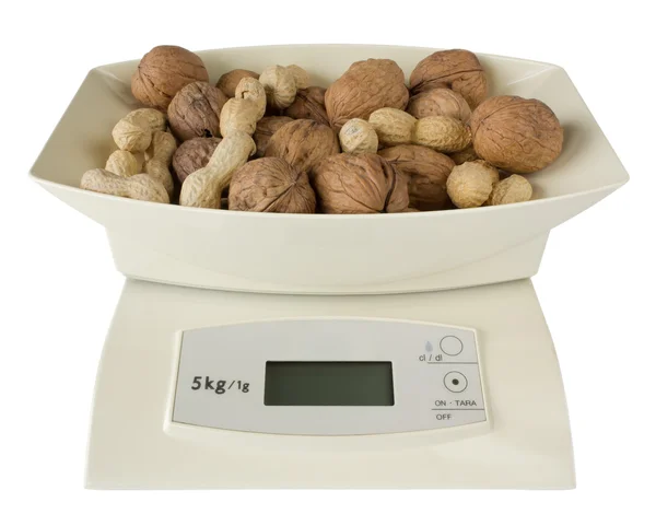 Scales with Walnuts and Peanuts — Stock Photo, Image