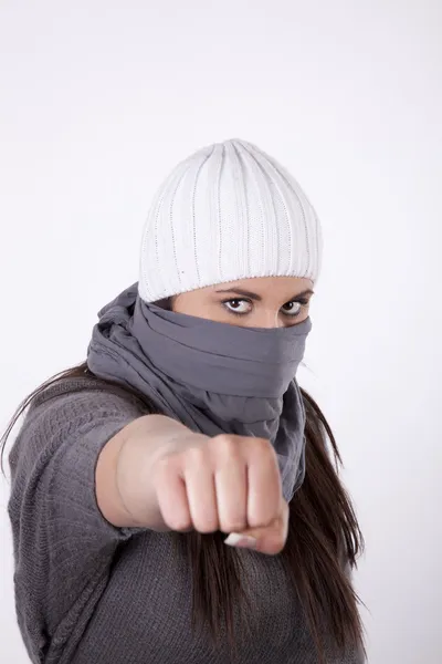Young masked woman with closed fist — Stock Photo, Image