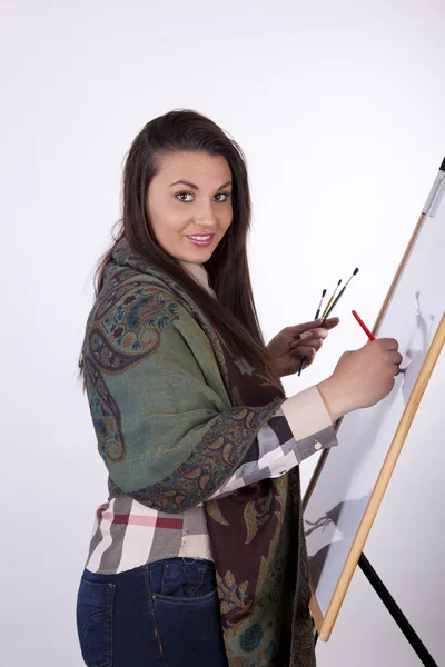Jovem mulher pintura — Fotografia de Stock