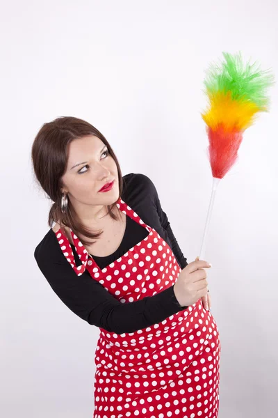 Young beautiful housewife dusting — Stock Photo, Image