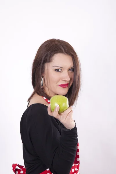 Junge schöne Frau hält einen grünen Apfel — Stockfoto