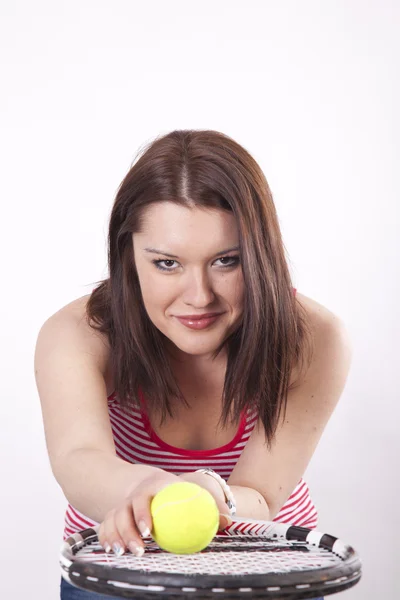 Young attractive woman holding her tennis racquet — Stock Photo, Image