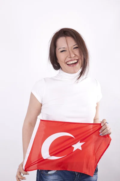 Молодая привлекательная женщина с флагом Турции — стоковое фото