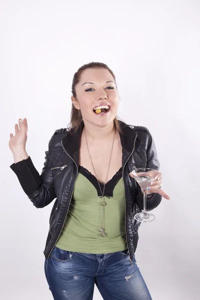 Beautiful woman eating olive — Stock Photo, Image