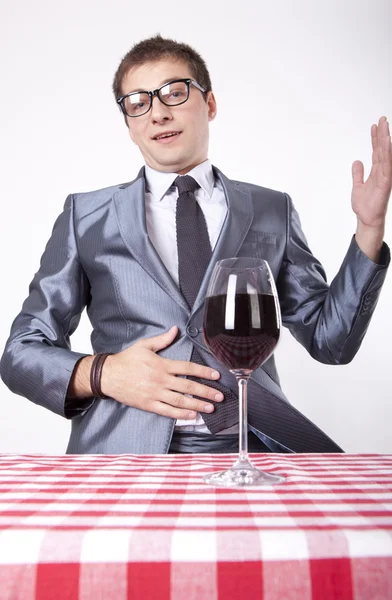 Young man with a glass of wine — Stock Photo, Image